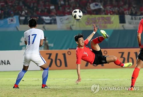 South Korea's Son Heung-min takes a shot against Malaysia during a football match at the 18th Asian Games at Si Jalak Harupat Stadium in Bandung, Indonesia, on Aug. 17, 2018.