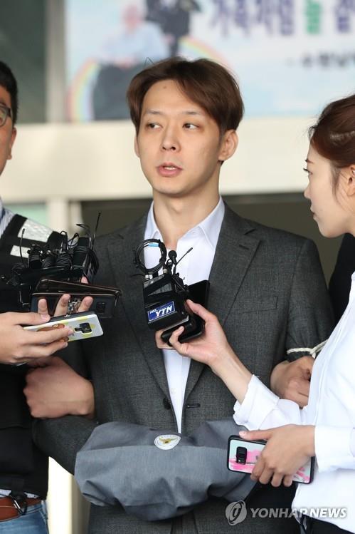 This file photo taken on May 3, 2019, shows K-pop singer-actor Park Yoo-chun responding to reporters at a police station in Suwon, south of Seoul. (Yonhap)
