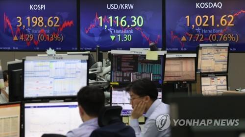 Electronic signboards at a Hana Bank dealing room in Seoul show the benchmark Korea Composite Stock Price Index (KOSPI) closed at 3,198.62 on April 16, 2021, up 4.29 points or 0.13 percent from the previous session's close. (Yonhap)