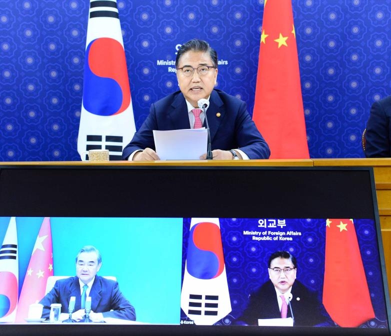 South Korean Foreign Minister Park Jin (upper center, bottom right) speaks from Seoul during a video call with his Chinese counterpart Wang Yi in this photo provided by Seoul's foreign ministry on May 16, 2022. (PHOTO NOT FOR SALE) (Yonhap)
