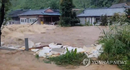 A village in Bonghwa, North Gyeongsang Province, is flooded by torrential rains on July 15, 2023, in this photo provided by a reader. (PHOTO NOT FOR SALE) (Yonhap)