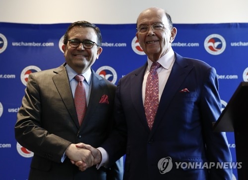 Commerce Secretary Wilbur Ross and Mexico Secretary of the Economy Ildefonso Guajardo Villarreal shake hands after a news conference at the U.S. Chamber of Commerce in Washington, Tuesday, June 6, about Mexico sugar exports. (AP Photo/Carolyn Kaster)