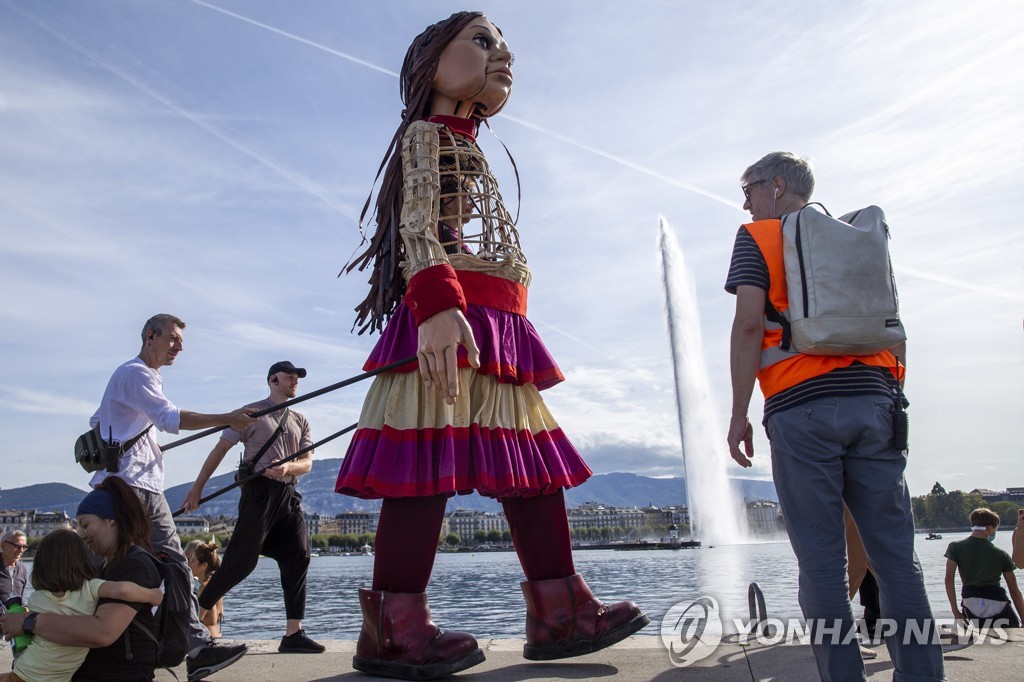SWITZERLAND GIANT PUPPET AMAL REFUGEE