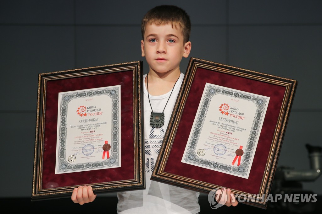 Chechen boy Rokhim Kuriyev sets two new world push-up records