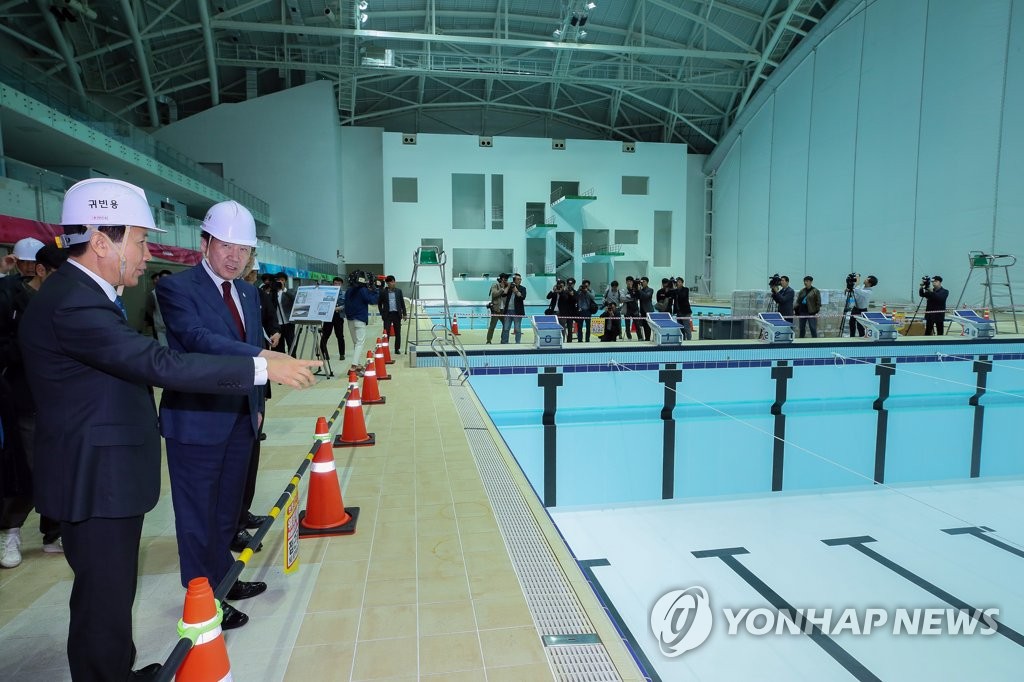 PM inspects venue for FINA championships PM inspects venue for FINA championships
