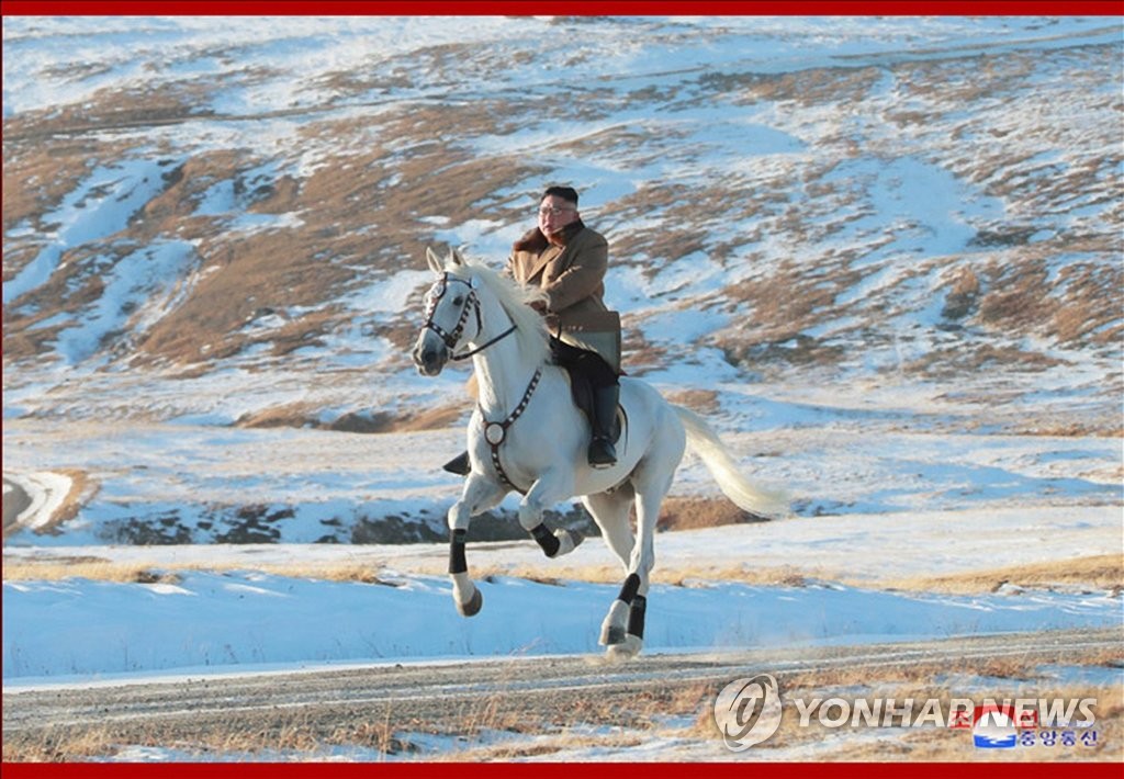 This photo, released by the Korean Central News Agency on Oct. 16, 2019, shows North Korean leader Kim Jong-un riding a white horse up a snow-covered Mount Paekdu, the country's highest peak on the border with China, after inspecting construction sites at the foot of the mountain. (For Use Only in the Republic of Korea. No Redistribution) (Yonhap)