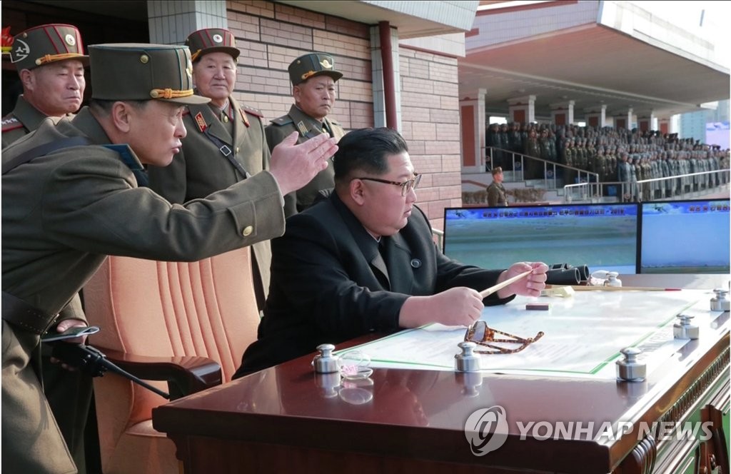 This photo, released by the North's Korean Central News Agency, shows North Korean leader Kim Jong-un (sitting) attending the combat flight contest held at Wonsan-Kalma airfield on Nov. 16, 2019. (For Use Only in the Republic of Korea. No Redistribution) (Yonhap)