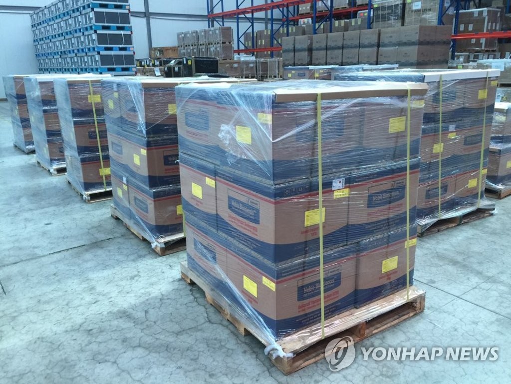 This photo, provided by the foreign ministry on March 17, 2020, shows boxes containing coronavirus specimen collection kits piled at a warehouse near Incheon International Airport, west of Seoul, before being shipped to the United Arab Emirates. South Korea said it has recently exported 51,000 kits to the Middle Eastern country. (PHOTO NOT FOR SALE) (Yonhap)