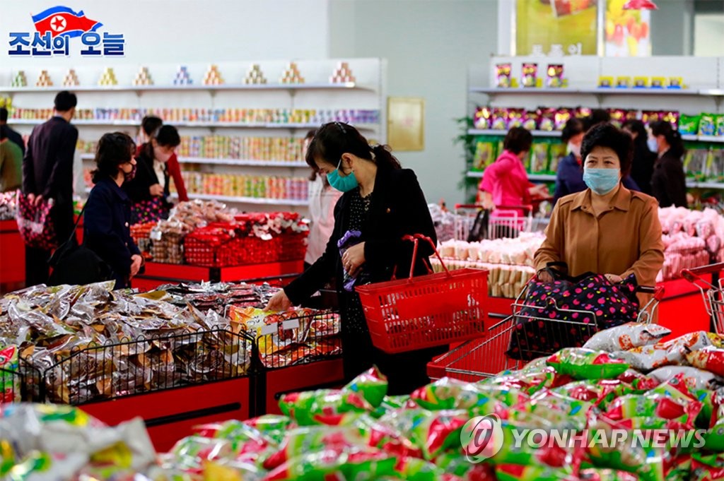 North Korean customers wearing masks shop at the Pyongyang Department Store amid the coronavirus pandemic, in this undated photo taken from North Korea's propaganda website DPRK Today on May 29, 2020. (PHOTO NOT FOR SALE) (Yonhap)