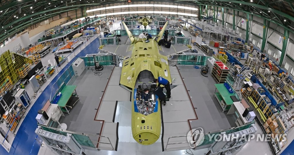 In this file photo, taken on Jan. 22, 2021, and provided by Korea Aerospace Industries (KAI), workers assemble the first prototype of South Korea's indigenous fighter jet KF-X at its plant in the southeastern city of Sacheon. (PHOTO NOT FOR SALE) (Yonhap)