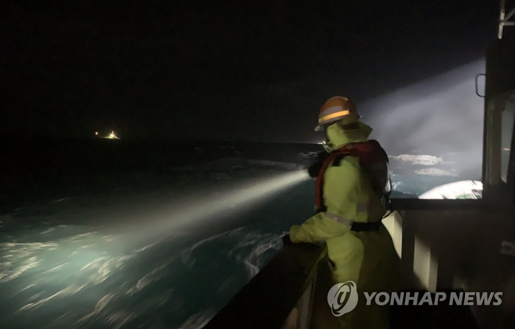 A search operation is under way in waters off the southern island of Geoje after a fishing boat capsized on Jan. 23, 2021, in this photo provided by the Coast Guard. (PHOTO NOT FOR SALE) (Yonhap)