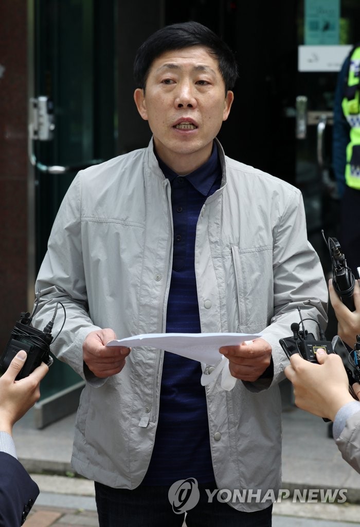Police raid defector activist's office Police raid defector activist's office