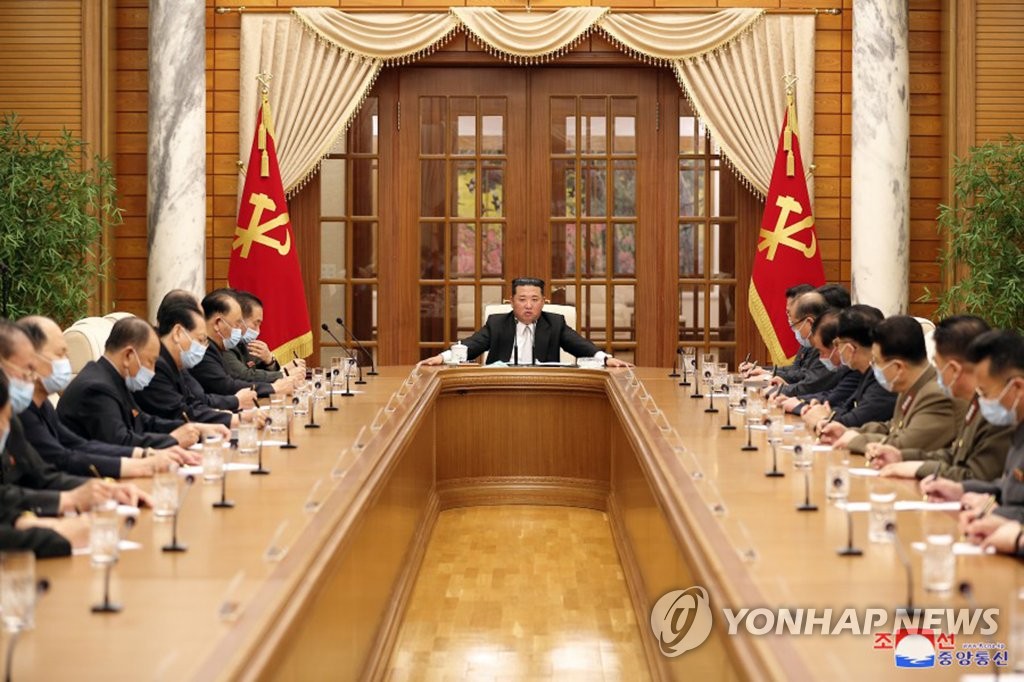 North Korean leader Kim Jong-un (C, rear) presides over a politburo meeting of the Workers' Party at the headquarters of the party's Central Committee in Pyongyang on May 12, 2022, over the discovery on May 8 of the North's first case of the omicron variant of COVID-19, in this photo taken from the website of the North's official Korean Central News Agency. (For Use Only in the Republic of Korea. No Redistribution) (Yonhap)