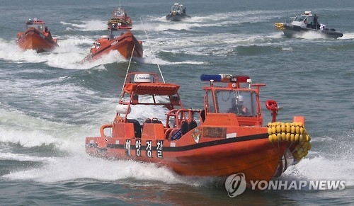 This undated photo shows Coast Guard boats engaging in maritime drills in waters off the country's west coast. (Yonhap)