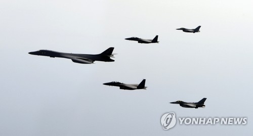 A B-1B Lancer, a strategic U.S. bomber, flies over Korea along with South Korean fighter jets in joint drills in this file photo provided by South Korea's Air Force. (Yonhap)