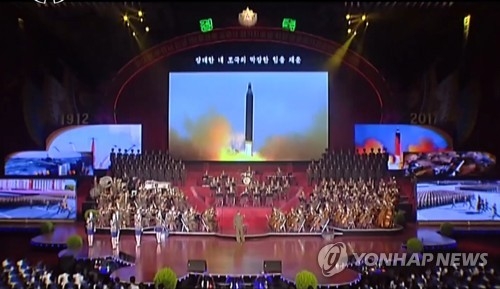 This image captured from footage by North Korea's state TV station on April 17, 2017, shows the a launch of an intermediate-range Musudan ballistic missile on a giant screen during the State Merited Chorus' latest performance. (For Use Only in the Republic of Korea. No Redistribution) (Yonhap)