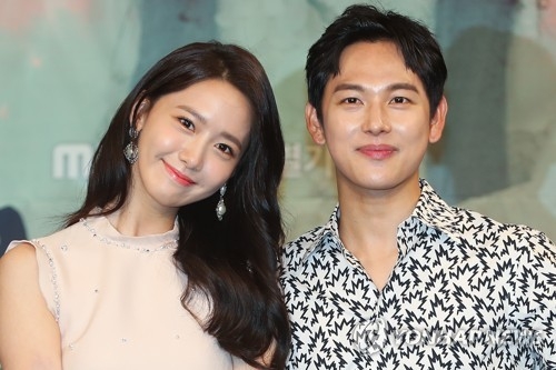 Singer-actress Yoona (L) and actor Im Si-wan, lead stars in MBC TV's new period drama "The King Loves," pose for the camera at a media event on July 3, 2017, at MBC TV's headquarters in western Seoul. (Yonhap)
