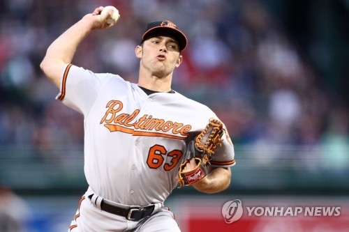 In this Getty Images file photo taken on May 4, 2017, Tyler Wilson, then of the Baltimore Orioles, throws a pitch against the Boston Red Sox during the first inning of their major league regular season game at Fenway Park. Wilson signed with the South Korean club LG Twins on Jan. 5, 2018. (Yonhap)