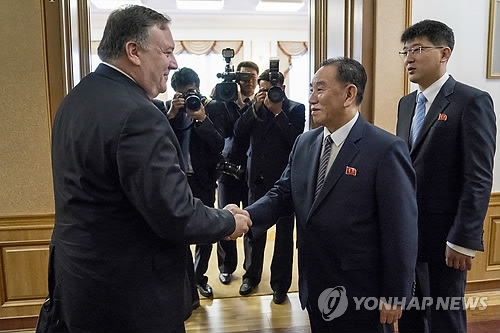 This AP photo shows U.S. Secretary of State Mike Pompeo (L) shaking hands with Kim Yong-chol, a top North Korean communist party official, at the Baekhwawon Guesthouse in Pyongyang on July 7, 2018. (Yonhap)