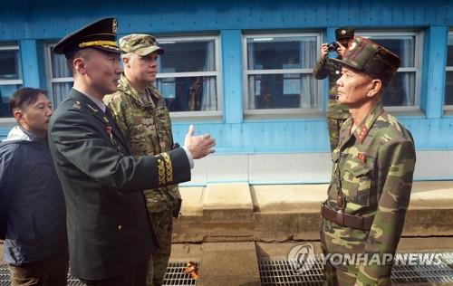 Military officers from the two Koreas and the United Nations Command have conversations regarding the demilitarization of the Joint Security Area on Oct. 30, 2018. (Yonhap)