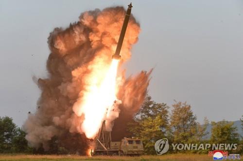 A projectile mounted on a super-large multiple rocket launcher is fired in South Pyongan Province, western North Korea, on Sept. 10, 2019, in this photo released by the North's Korean Central News Agency on Sept. 11. The North tested the launcher under the guidance of North Korean leader Kim Jong-un. (For Use Only in the Republic of Korea. No Redistribution) (Yonhap)