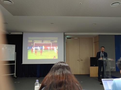 The World Cup qualifying match between South Korea and North Korea is being shown on a projector at the Korea Football Association House in Seoul on Oct. 17, 2019. (Yonhap)