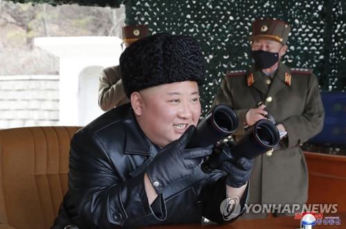 North Korean leader Kim Jong-un (front) watches a firepower strike drill by the North Korean army's long-range artillery sub-units on March 2, 2020, in this photo released by the North's official Korean Central News Agency the next day. The report came one day after South Korea said the North fired what appeared to be two ballistic missiles. (For Use Only in the Republic of Korea. No Redistribution) (Yonhap)
