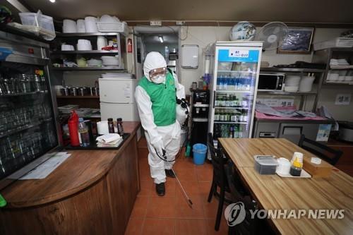 A worker disinfects a restaurant in the Itaewon area of Seoul on May 12, 2020. (Yonhap)