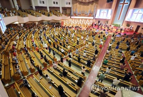 Worshipers attend a Sunday service while maintaining social distancing at the Yeouido Full Gospel Church in Seoul on Aug. 16, 2020. (Yonhap)
