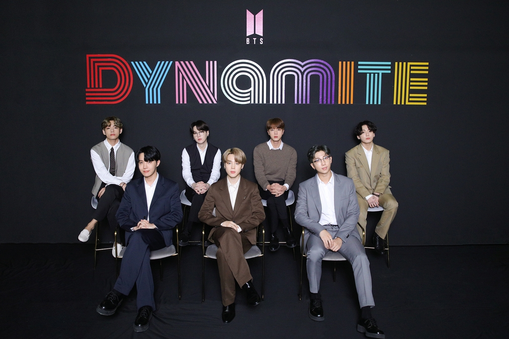 This photo, provided by Big Hit Entertainment on Sept. 2, 2020, shows members of K-pop sensation BTS posing for photos during an online press conference to celebrate the band's single "Dynamite" debuting at No. 1 on the Billboard Hot 100 chart. (PHOTO NOT FOR SALE) (Yonhap)