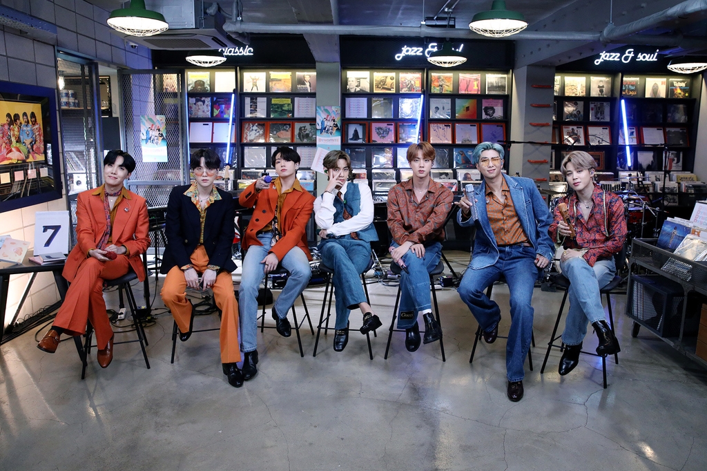 This photo provided by Big Hit Entertainment on Sept. 21, 2020, shows K-pop group BTS posing for photos at a studio in South Korea where the band filmed a performance for the "Tiny Desk Concert" show on National Public Radio in the U.S. (PHOTO NOT FOR SALE) (Yonhap)