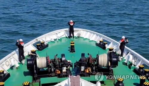 The Coast Guard and Navy conduct an operation to search for the body of a fisheries official near the de facto inter-Korean sea border, in this photo provided by the Coast Guard. (PHOTO NOT FOR SALE) (Yonhap) 