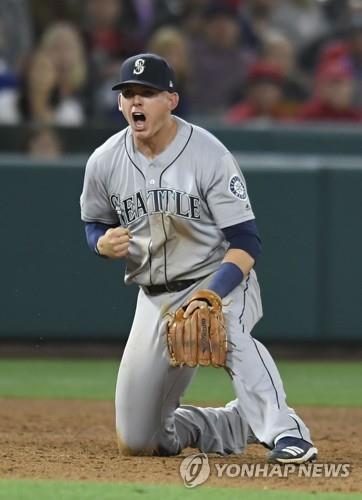 In this Getty Images file photo from April 18, 2019, Ryon Healy of the Seattle Mariners reacts to throwing out David Fletcher of the Los Angeles Angels for the final out of a Major League Baseball regular season game at Angel Stadium of Anaheim in Anaheim, California. (Yonhap)