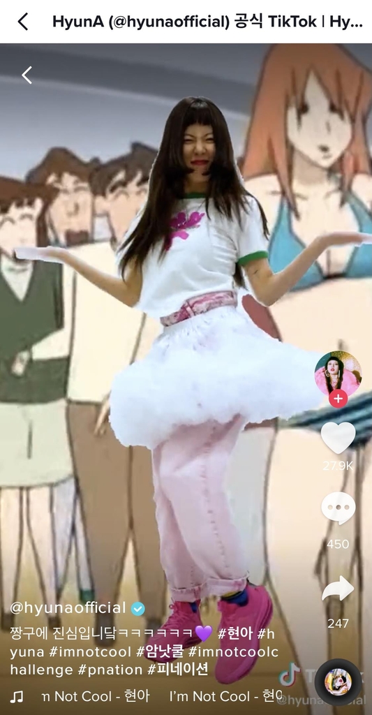 This screenshot, taken from HyunA's official TikTok account, shows the singer dancing to her new song "I'm Not Cool" against an image of a "Crayon Shin-chan" episode. (PHOTO NOT FOR SALE) (Yonhap)