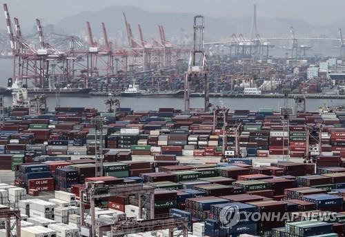 This file photo shows stacks of import-export cargo containers at South Korea's largest seaport in Busan, 450 kilometers southeast of Seoul. (Yonhap