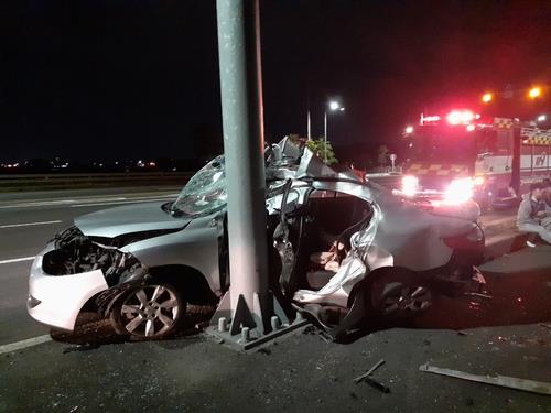 This file photo, provided by the fire authority of the southern Jeju Island, shows a car that crahsed into a traffic pole. The car was known to have been driven by an unlicensed 18-year-old. (PHOTO NOT FOR SALE) (Yonhap)