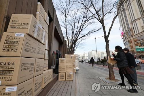 This photo, taken Feb. 7, 2022, shows piles of boxes containing rapid COVID-19 antigen test kits, which were delivered to a state medical center in eastern Seoul. (Yonhap)