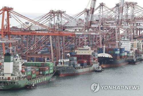 This photo, taken June 15, 2022, shows stacks of containers at a port in South Korea's southeastern city of Busan. (Yonhap)