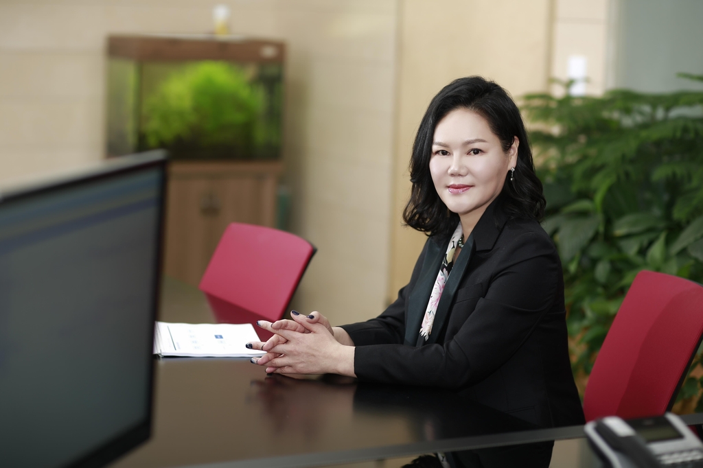 This file photo provided by Highland Group shows the company's founder and CEO Youn Young-mi at her desk in its headquarters building in eastern Seoul. (PHOTO NOT FOR SALE) (Yonhap)