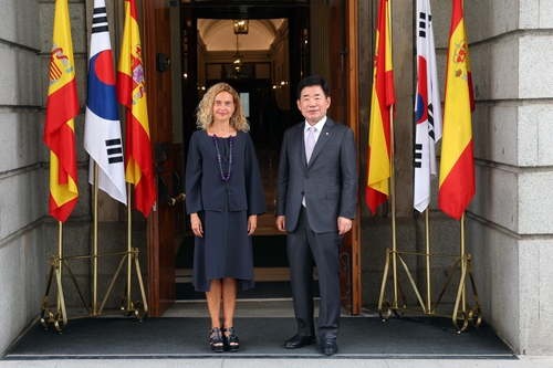 This photo, provided National Assembly Speaker Kim Jin-pyo's office on Sept. 13, 2022, shows the parliamentary speaker and Meritxell Batet Lamana, president of the Spanish Congress of Deputies, posing for a photo in Madrid. (PHOTO NOT FOR SALE) (Yonhap)