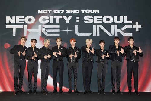 NCT 127 poses for the camera during a press conference held at Olympic Stadium in southern Seoul on Oct. 23, 2022, a few hours before a concert there, in this photo provided by SM Entertainment. (PHOTO NOT FOR SALE) (Yonhap)