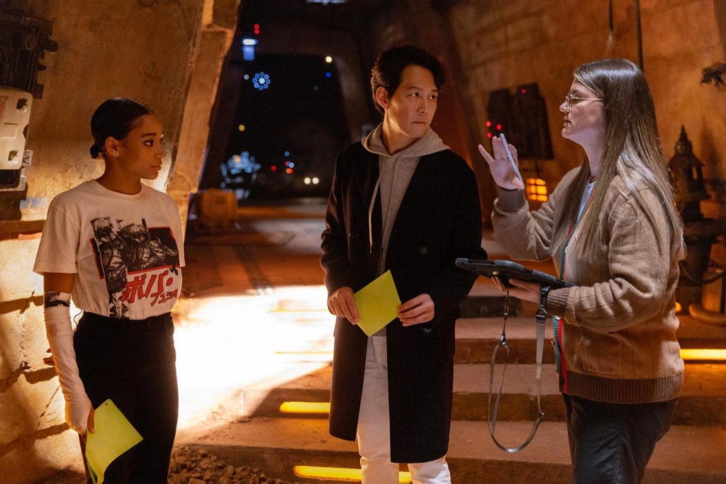 Leslye Headland (R), director of the upcoming original Star Wars series "The Acolyte," as well as series leads Lee Jung-jae (C) and Amandla Stenberg (L) are seen in this behind-the-scenes photo taken from the official Star Wars website. (PHOTO NOT FOR SALE) (Yonhap)