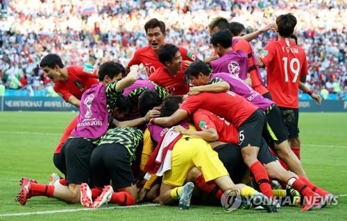 In this file photo from June 27, 2018, South Korean players celebrate after Son Heung-min's goal against Germany during the teams' Group F match at the FIFA World Cup at Kazan Arena in Kazan, Russia. (Yonhap)