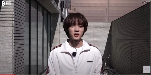 Jin, the eldest member of K-pop supergroup BTS, is seen in this photo captured from a video posted on the band's official YouTube channel on Jan. 9, 2023. (PHOTO NOT FOR SALE) (Yonhap)