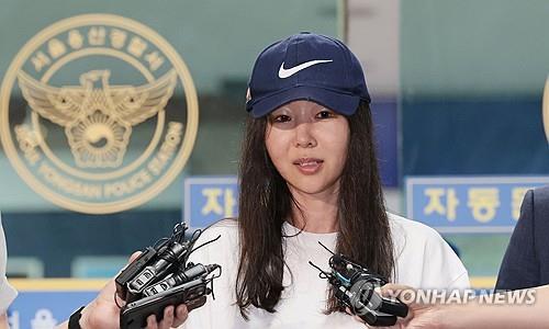 In this file photo, Min Hee-jin, former CEO of K-pop label ADOR, answers reporters' questions after undergoing police questioning at Yongsan Police Station in Seoul on July 9, 2024. (Yonhap)