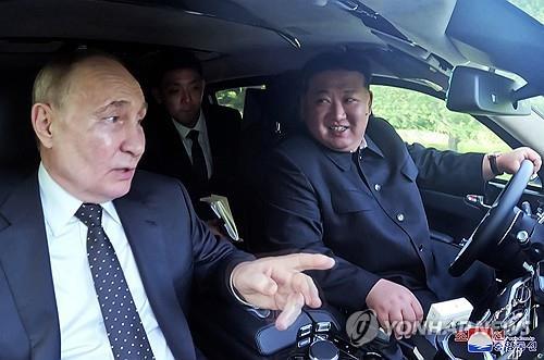 This file photo shows North Korean leader Kim Jong-un (R) and Russian President Vladimir Putin riding a car together in Pyongyang in June 2024 during Putin's visit to North Korea. (For Use Only in the Republic of Korea. No Redistribution) (Yonhap)