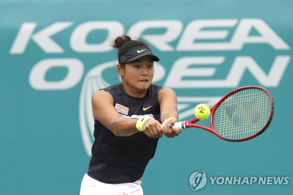 In this Associated Press photo, Wang Yafan of China returns a shot to Paula Badosa of Spain during their women's singles quarterfinals match at the Korea Open at Olympic Park Tennis Center in Seoul on Sept. 20, 2019. (Yonhap)