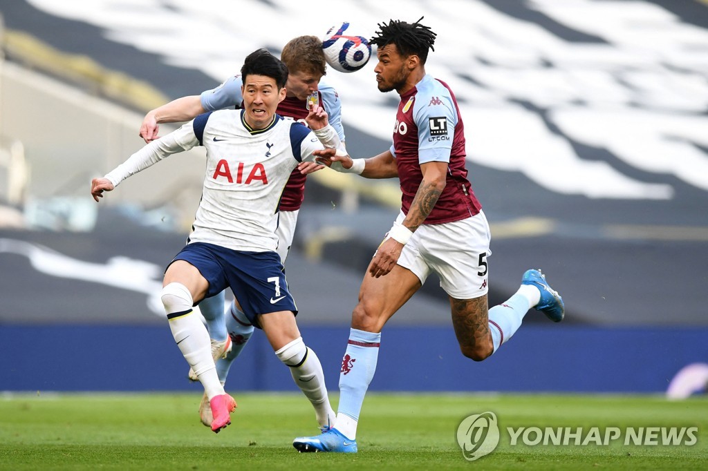 In this AFP file photo from May 19, 2021, Son Heung-min of Tottenham Hotspur (L) battles Tyrone Mings of Aston Villa (R) for the ball during their Premier League match at Tottenham Hotspur Stadium in London. (Yonhap)