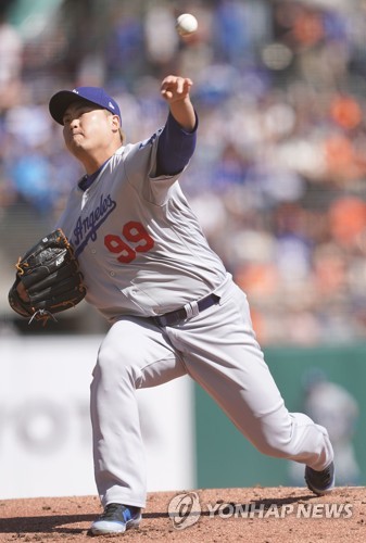 Los Angeles Dodgers starting pitcher Hyun-Jin Ryu, of South Korea, throws  to the plate during the first inning of a baseball game against the Arizona  Diamondbacks Sunday, Aug. 11, 2019, in Los