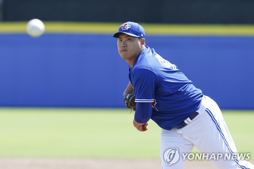 In this USA Today Sports photo via Reuters, Ryu Hyun-jin of the Toronto Blue Jays throws a warmup pitch before a spring training game against the Tampa Bay Rays at TD Ballpark in Dunedin, Florida, on March 9, 2020. (Yonhap)